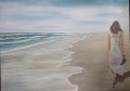 woman walk at beach watermark